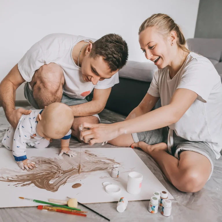 young family playing with baby - therachange